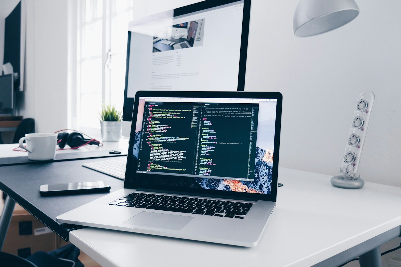 Custom WordPress theme code on a laptop