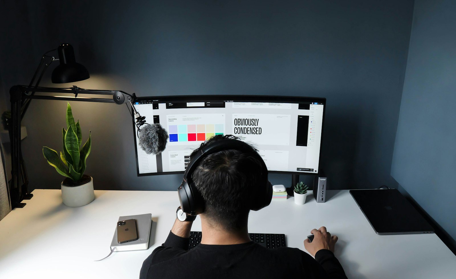 Designer creating a dashboard UI on a computer