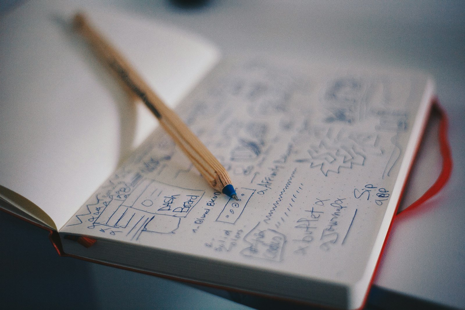 Logo design sketch in a notebook