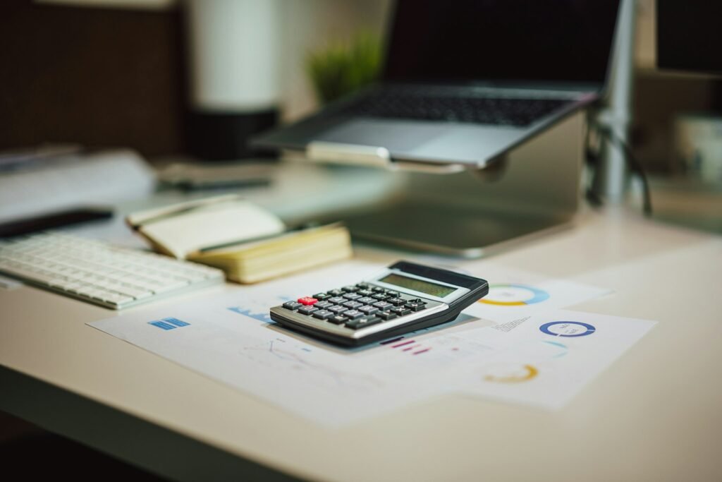 Calculator and laptop for planning website cost in India