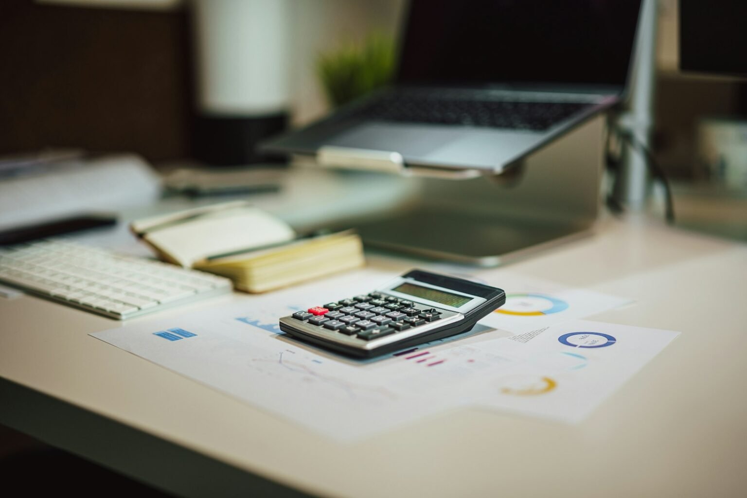 Calculator and laptop for planning website cost in India
